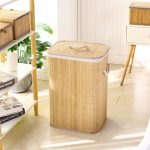 Sleek natural bamboo laundry hamper with closed lid in a contemporary living room