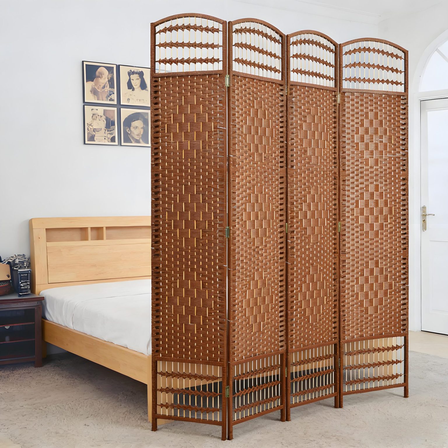 Customizable natural brown woven wooden screen used as a privacy partition beside a bed in a modern bedroom