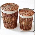 Large willow basket holding a potted plant in a garden room setting